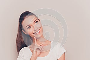 Portrait of attractive minded woman dreaming about something