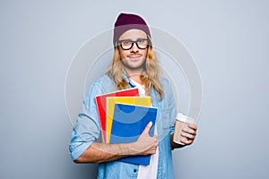 Portrait of attractive, nice, cute guy in cap holding three colo