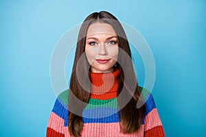 Portrait of attractive nice lovely girl look good in camera wear pullover isolated over blue color background