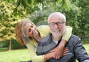 Portrait of an attractive older couple smiling outdoors