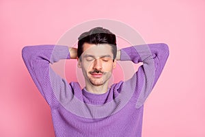 Portrait of attractive peaceful guy resting pause break isolated over pink pastel color background