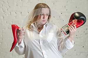 Portrait of attractive plus size woman having emotions of choice isolated over white background. A girl in a white shirt is