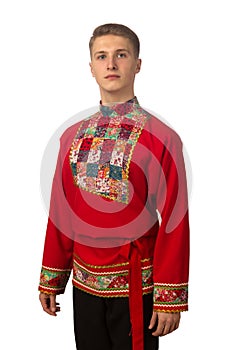 Portrait of the attractive russian guy in red folk costume isolated on white