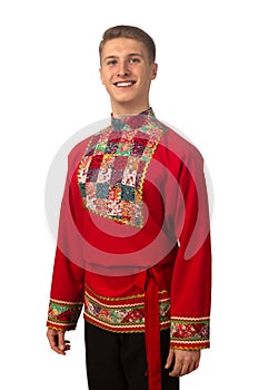 Portrait of the attractive russian guy in red folk costume isolated on white