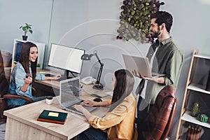 Portrait of attractive skilled cheerful people marketing experts developing creating strategy at work place station