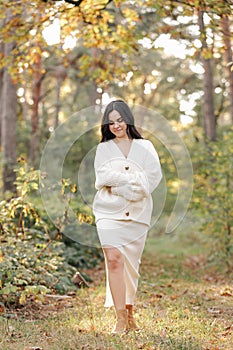 Portrait of attractive smiling caucasian brunette woman. The face of a happy and relaxing beautiful woman with long hair