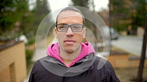 Portrait of Attractive Smiling Hispanic Ethnicity Young Man in Urban Environment. Young hispanic man smiling and looking