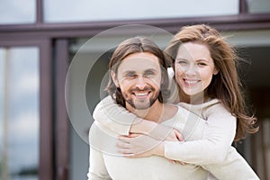 Portrait of attractive smiling married couple outdoors