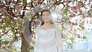 Portrait attractive sunshine young smiling woman with long hair look at camera smile portrait happy summer face sunset