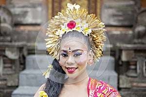 Attractive traditional balinese dancer smiling