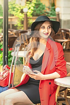 Portrait of attractive woman in cafe outdoors