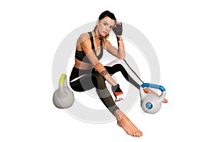 Portrait of attractive woman , fitness breaking relax after kettlebells workout or sitting tired. - Image