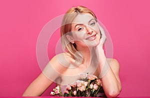 Portrait of attractive woman with pink rose. Beautiful fashion girl, headshot portrait. Perfume cosmetics concept