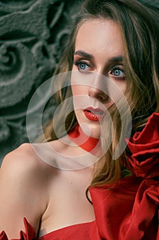 Portrait of an attractive woman in red. Fashion photo