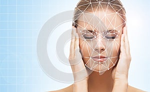 Portrait of attractive woman with a scnanning grid on her face. Face id, security, facial recognition.