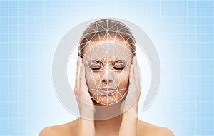 Portrait of attractive woman with a scnanning grid on her face. Face id, security, facial recognition.