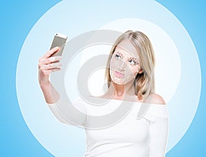 Portrait of attractive woman with a scnanning grid on her face. Face id, security, facial recognition, future technology