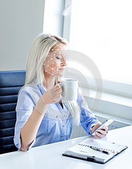 Portrait of attractive woman with a scnanning grid on her face. Face id, security, facial recognition, future technology