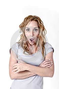 Portrait of attractive woman surprised and excited in shock and disbelief