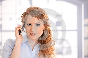 Portrait of attractive woman using mobile phone