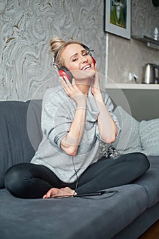 Portrait of attractive woman using smart phone to listen to music