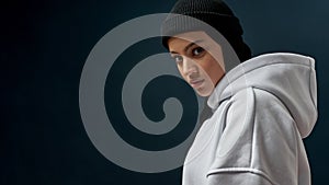 Portrait of attractive young arabian woman in cap