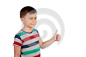 Portrait of attractive young boy, smiling showing thumbs up, on white background. Copy space