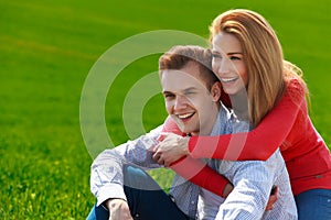 Portrait of attractive young couple in love outdoors.