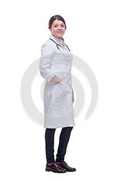 Portrait of an attractive young female doctor or nurse with stethoscope in white uniform
