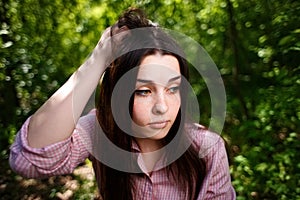 Portrait of attractive young hesitant perplexed woman face clos photo