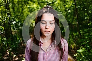Portrait of attractive young indecisive shy woman face close up