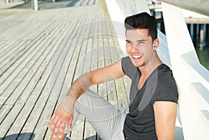 Portrait of an attractive young man smiling outdoors