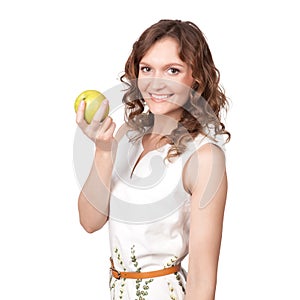 Portrait of an attractive young woman with an apple