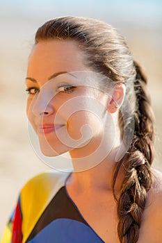 Portrait of attractive young woman looking at camera smiling