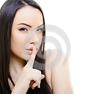 Portrait of attractive young woman with secret over white backgr