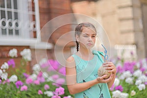 Portrait of attractive young woman traveler drinking coconut juice walking on downtown street. lifestyle concept