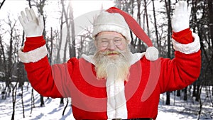 Portrait of authentic Santa Claus waving with hands.