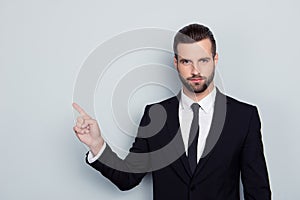 Portrait of authoritative strict manful bossy serious angry confident focused expert assistant wearing white shirt black tie photo