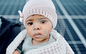 Portrait, baby and beanie with a girl child in a blanket during winter looking cute or adorable. Children, babies and