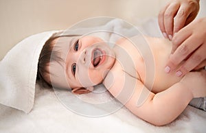 Portrait, baby and boy with diaper, smile and excited with blanket or relax with happiness. Face, infant or kid with