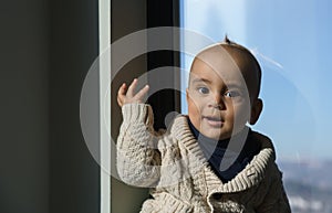 Portrait of a baby boy wearing knitted sweater