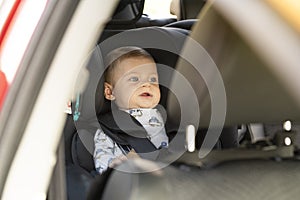 Baby in the car seat looking around