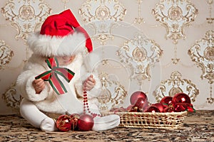 Portrait of a baby in a Christmas hat