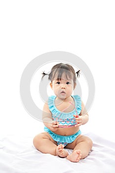 Portrait baby girl in swimsuit