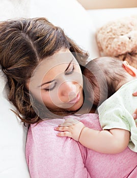 Portrait of a baby and his mother sleeping