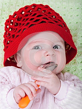 Portrait baby in red bonnet