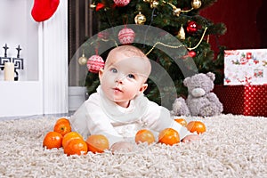 Portrait of baby with tangerine