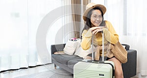 Portrait of backpacker beauty asian traveler woman packing prepare stuff and outfit clothes in suitcases travel bag luggage for