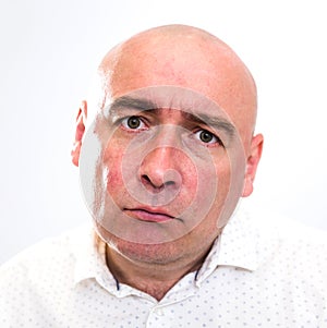 Portrait of bald adult mature man with emotions on white background