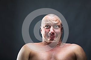 Portrait of bald scared man photo